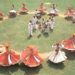 Rajasthani male folk performers, some wearing the Long Agarkha while others wearing the Kamri Angarka.
