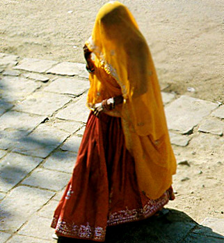 Rajasthani woman dressed in full traditional attire including the Ghaghra, Kurti and Odhna